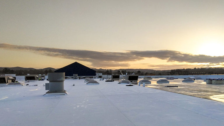 commercial roof at sunset
