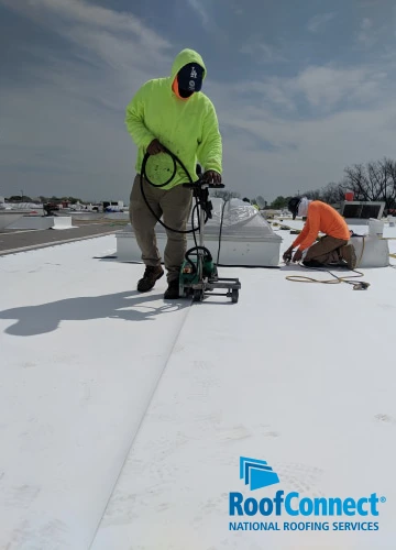 RoofConnect Roofers performing emergency roof repairs on a Walmart in Little Rock.